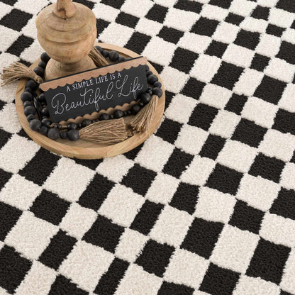 Lajos Black &amp; White Checkered Plush Rug