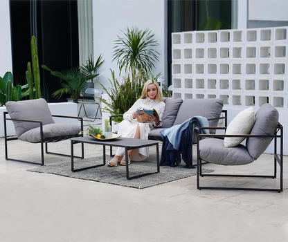 4 Piece Outdoor Slingback Furniture Set With Modern Metal Frames and Gray Cushions