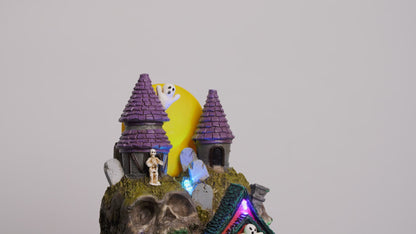 Skullstone Hollow Skull - Spooky Halloween Village - Multi-Color LED Lights, Animated Motion and Music - 7.75" x 7.5" x 13.5"